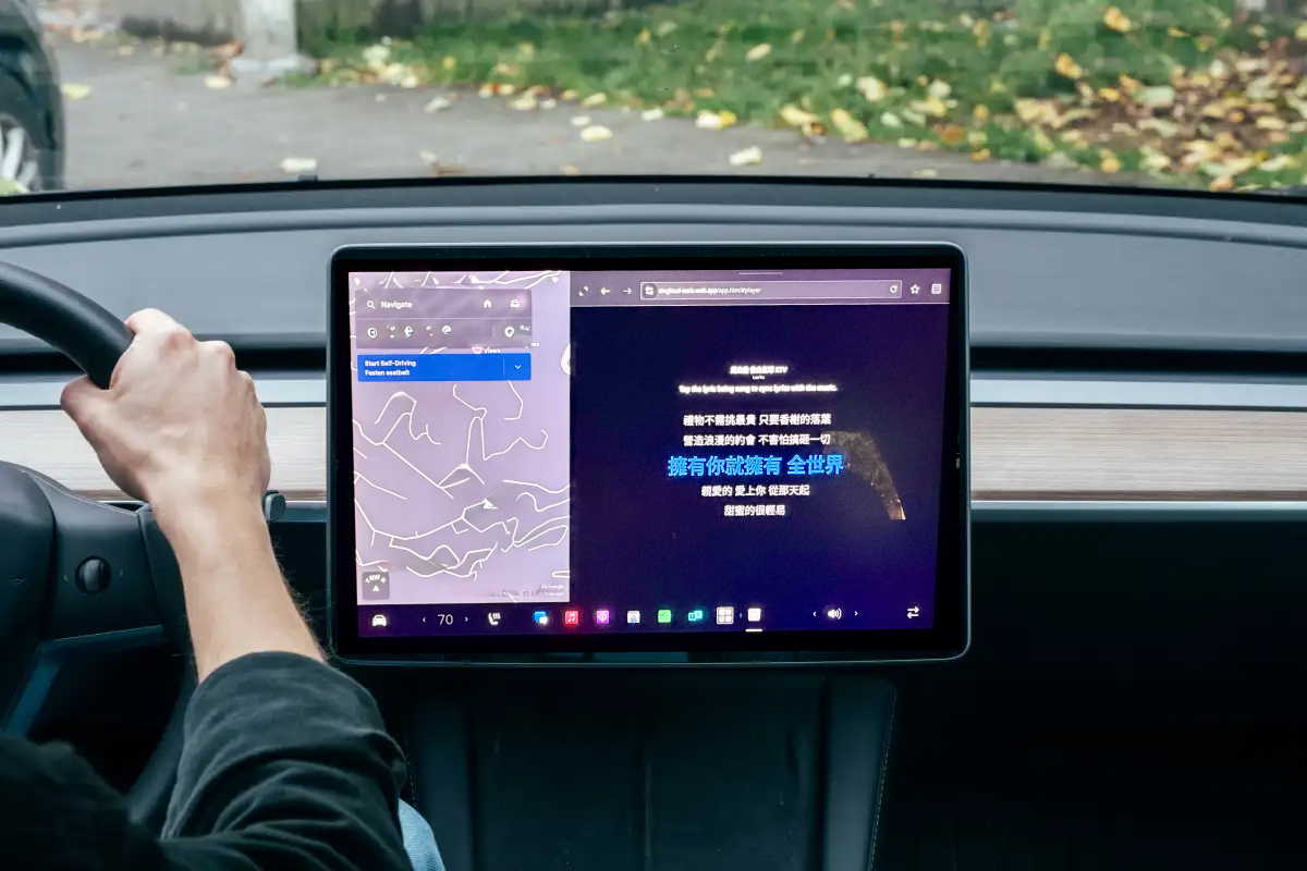 SingLoud karaoke lyrics close-up on Tesla screen